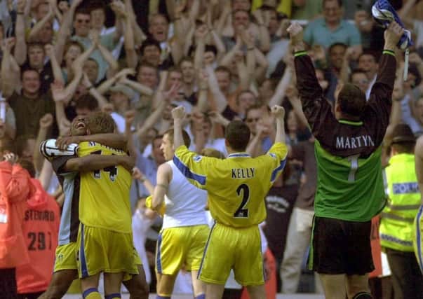 The Leeds players and fans celebrate their qualification for the Champions League in 2000.