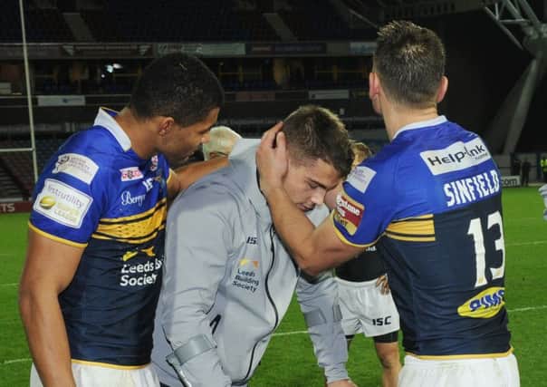 Stevie Ward with Kallum Watkins and Kevin Sinfield.
