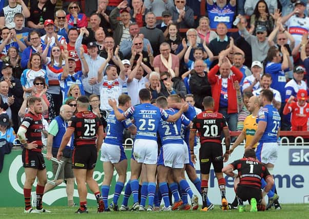 Wakefield Trinity Wildcats celebrate victory over Warrington Wolves.