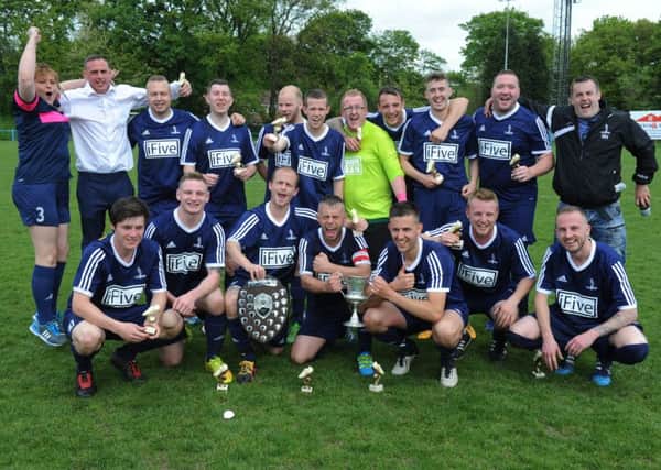 West Leeds Wortley celebrate their Leeds Sunday League President's Cup final victory over East Leeds Celtic.