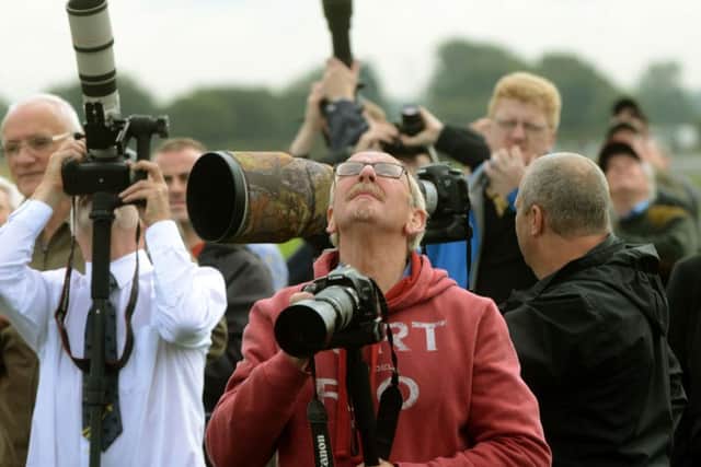Visitors keep their eyes on the skies at the 2015 show.