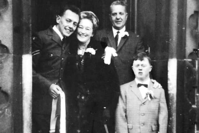 Vernon Knight, with his mum and dad and older brother Chris
