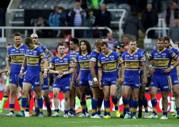 Leeds Rhinos' players stand dejected after defeat to Wigan at St James' Park: Richard Sellers/PA