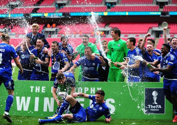 FC Halifax Town celebrate their FA Trophy final victory over Grimsby Town PIC: Jonathan Gawthorpe