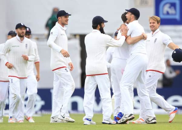 James Anderson (third right hidden) celebrates after bowling Sri Lanka's Nuwan Pradeep to win the first Test for England and to record his second five-wicket haul of the match at Headingley. Picture: Nigel French/PAinformation.