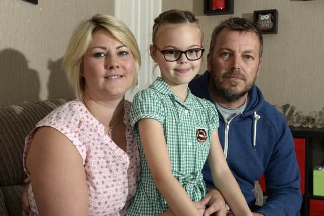 Vicky and Mark Walter, who lost their son Henry, are pictured with their daughter Tilly. Picture by Bruce Rollinson.