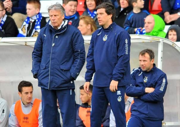 Bristol Rovers manager Darrell Clarke (centre) pictured while assistant to then manager John Ward (left).
