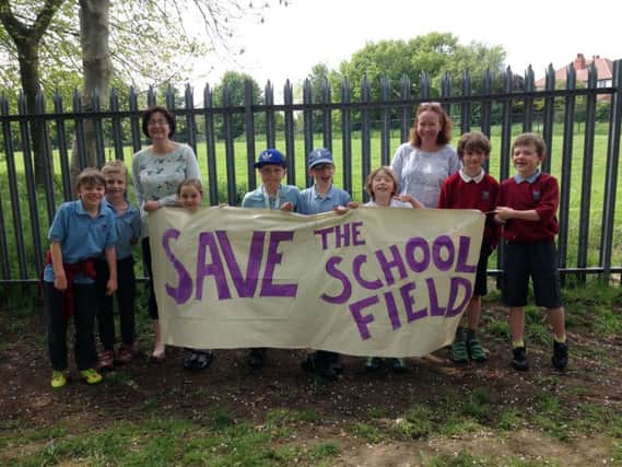 Parents and pupils who want Gledhow Primary to retain a school field rather than have it turned into a village green.
