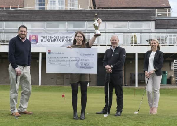 Mark Billington (Allied Irish Bank GB),  Niamh Rutherford (holding the trophy), Adrian Newboult (Pro at Leeds Golf Club) and Siobhan McGarry (Allied Irish Bank GB).