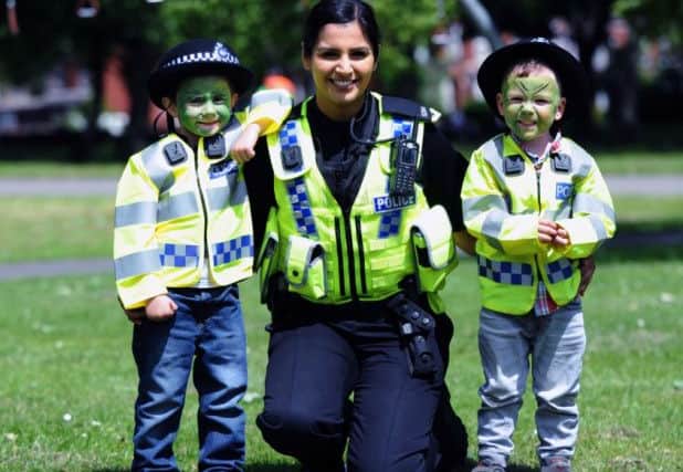 Caelan Bedford-Northage and Luke Bedford meet Special Constable Jas Sagu at a previous Beeston Festival.