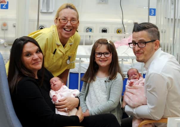 Sarah Sevier, her husband Martin, their twins Freya and Olivia, five-year-old Gracie, and nursery nurse Denise Warren