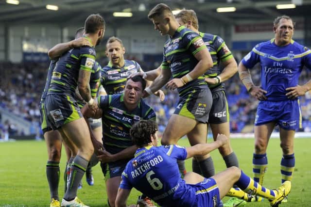 Rhinos' Brett Ferres is congratulated after scoring his second try. Picture: Bruce Rollinson
