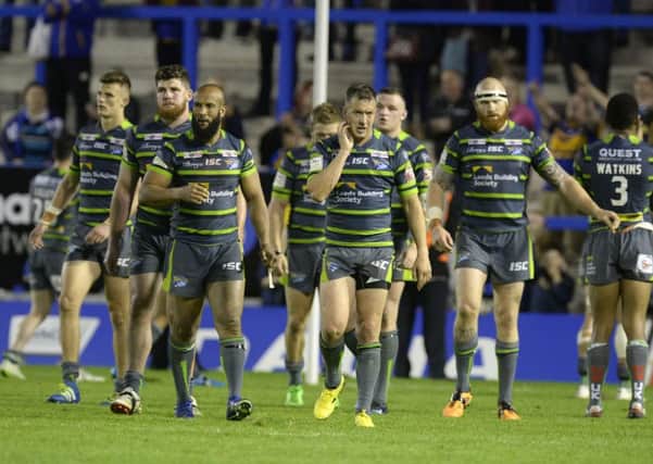 NIGHT TO FORGET: Leeds Rhinos' dejected players leave the field after losing 52-18 to new Super League leaders, 
Warrington Wolves. Picture: Bruce Rollinson