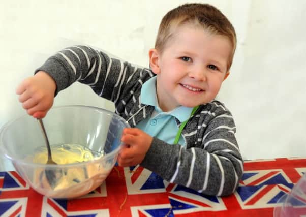 Noah Garlick, five, of Moortown making cheesecake at the Diddy Cook tent