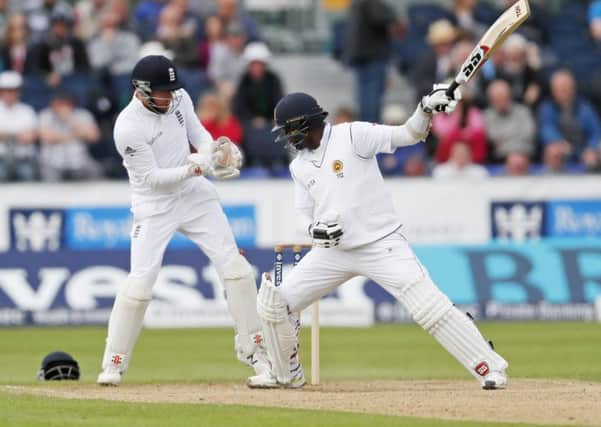 Jonny Bairstow does a neat take behind the stumps after Sri Lanka's Angelo Mathews misses a square cut. Picture: PA.
