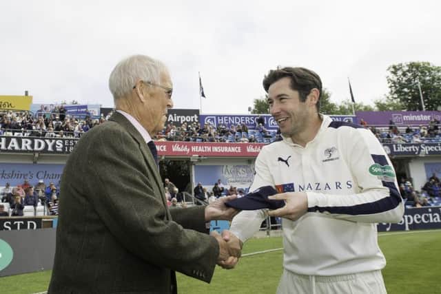 Yorkshire's Andrew Hodd is presented with his county cap by club president John Hampshire. Picture by Allan McKenzie/SWpix.com