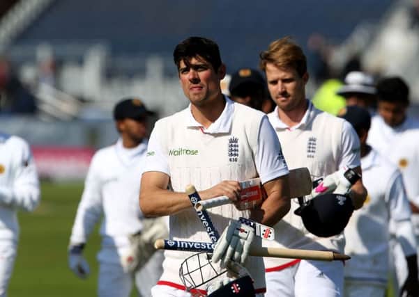 RECORD BREAKER: England's Alastair Cook (left) and Nick Compton walk off the pitch after winning the second test on day four at the Riverside. Picture: Richard Sellers/PA