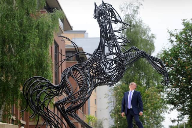 Russell Galley, of Halifax Community Bank, looks up at the Black Horse at Lovell Park, Leeds.