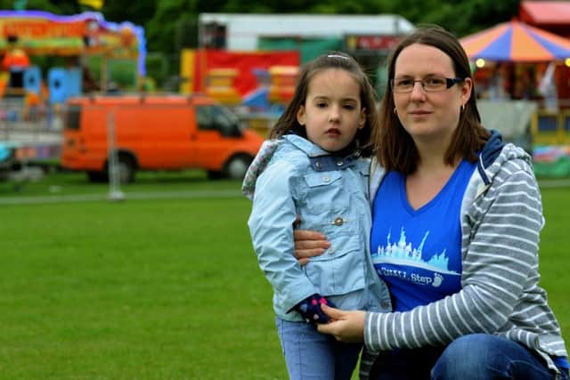 Catherine Shaw and her daughter Eleanor, seven, pictured at Roundhay Park, Leeds. Picture by Gary Longbottom.