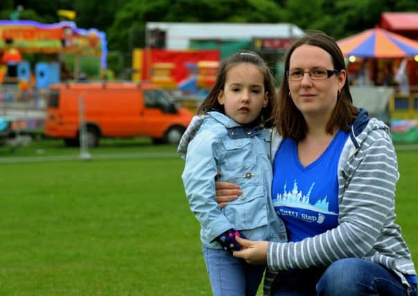 Catherine Shaw and her daughter Eleanor, seven, pictured at Roundhay Park, Leeds. Picture by Gary Longbottom.