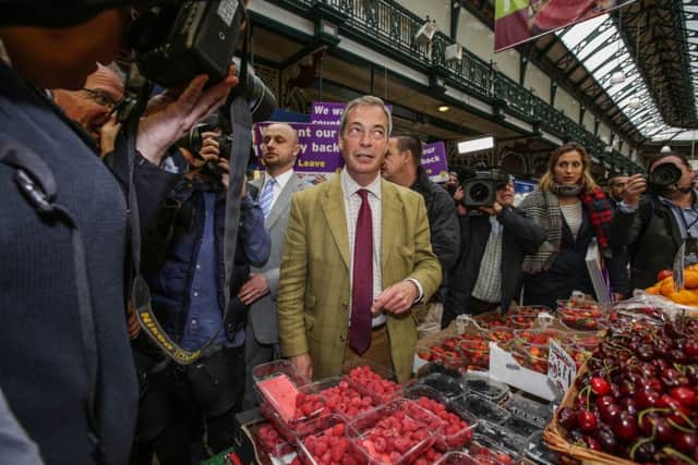 UKIP leader Nigel Farage takes a walk around Leeds Kirkgate market to talk to the public as part of his Leave campaign in the upcoming European referendum.