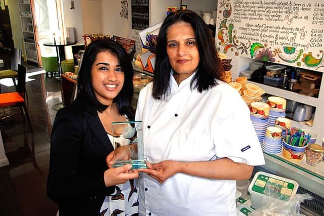 NAWN. Chef Rekha Sonigsa right, and her daughter Upasana from Wetherby's vegetarian Indian Restaurant Mango, proudly show off their award after winning best curry at the Leeds Curry Awards. 110629ARpic2.