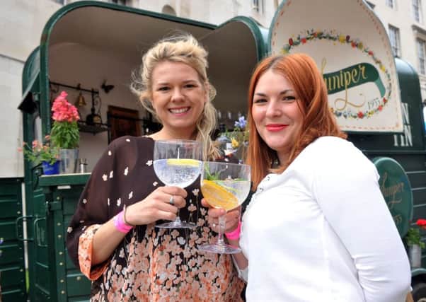 Kay Chapman and Laura Tacey serving gin from their Juniper 1933 van at the Yorkshire Food and Drink Show at Millennium Square, Leeds. Pictures: Tony Johnson.