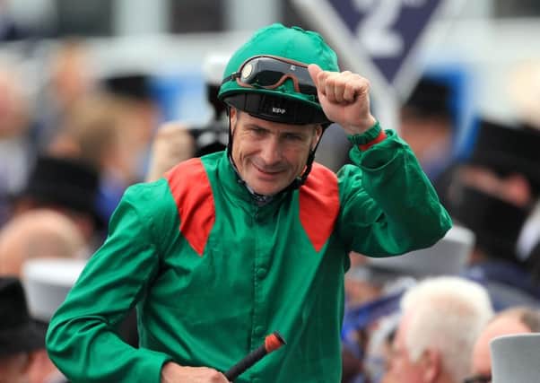 Jockey Pat Smullen celebrates after winning the Investec Derby.