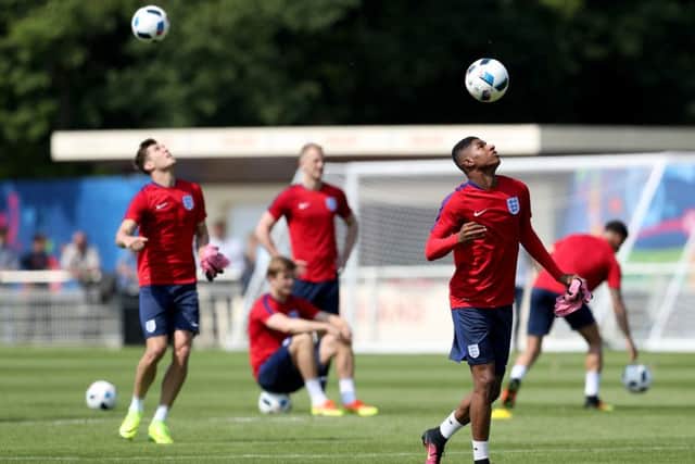 England's Marcus Rashford (right) during a training session at Stade de Bourgognes. Picture: Owen Humphreys/PA