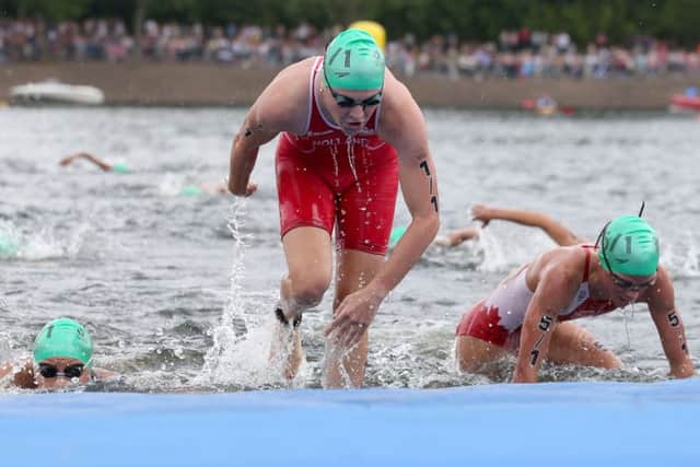 England's Vicky Holland during her leg of the Mixed Team Relay at Strathclyde Country Park during the 2014 Commonwealth Games near Glasgow.