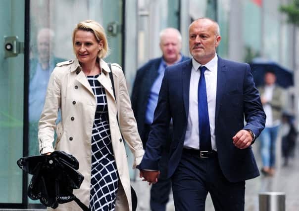 Ex Leeds United Education and Welfare Officer Lucy Ward and partner former Leeds United manager Neil Redfearn arrive at the tribunal.