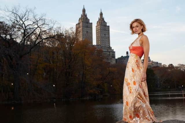 Actress Catherine Kelly in a gown created especially for her by James Steward.