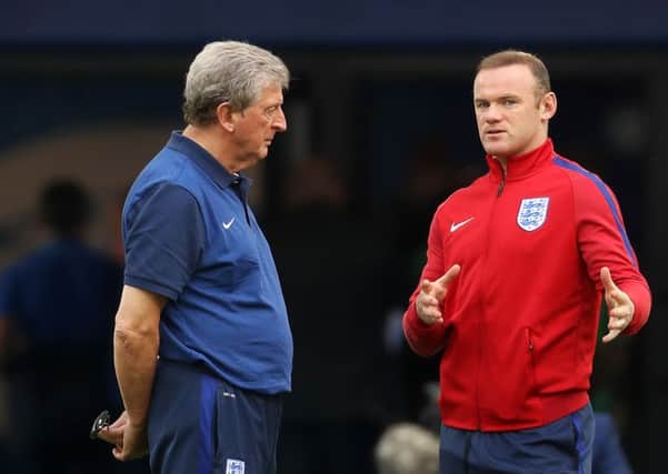 England's Wayne Rooney (right) speaks with manager Roy Hodgson during the squad walkaround at the Stade Velodrome, Marseille.