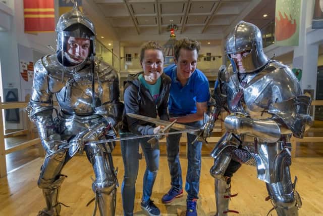 ITU World Triathlon Elite competitors Flora Duffy, current XTERRA Mountain Champin and ITU Cross Triathlon World Champion 2015 in 2015 with Alistair Brownlee, challenging two knights Scot Hurst (correct) and Keith Ducklin, from the Royal Armouries.