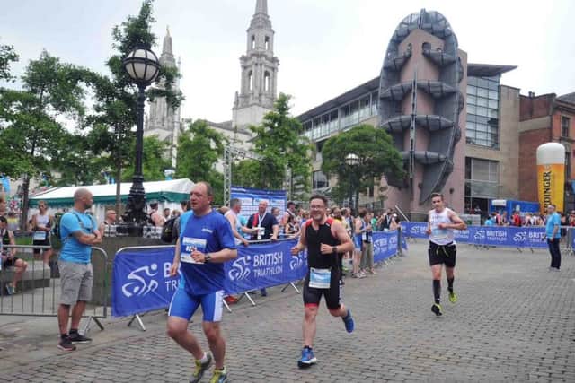 Age Group competitors finish in Millennium Square in the support race before WTS race in Leeds. Picture Tony Johnson