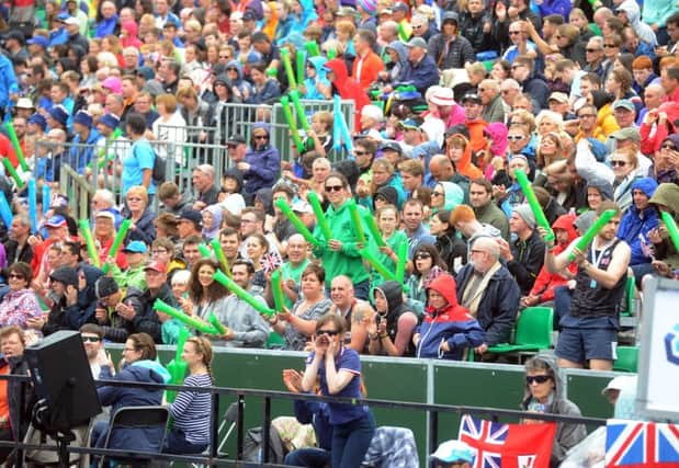 Crowds cheer the females through Millenium Square in the 2016 ITU World Triathlon Leeds.  Picture Tony Johnson