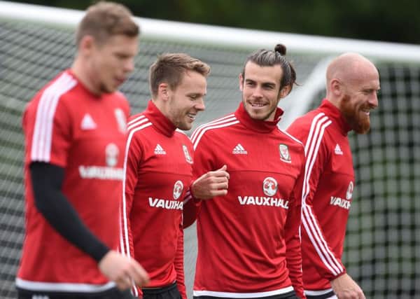 Wales' Simon Church, Chris Gunter, Gareth Bale and James Collins during a training session ahead of the England clash. PIC: PA