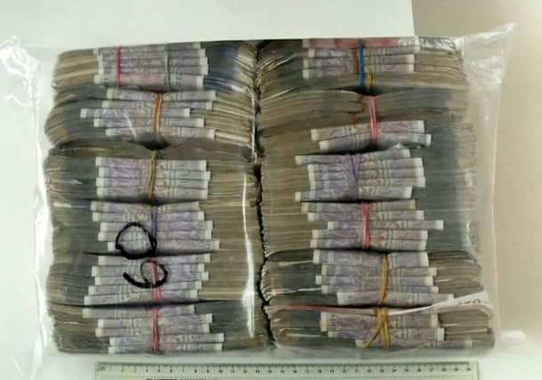 Cash seized from the gang in the 'Monopoly money' fraud case which has been heard at Bristol Crown Court. Picture: SWNS
