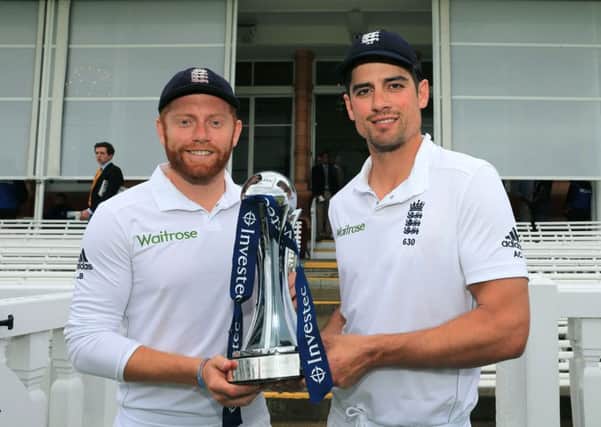 Englands man of the series Jonny Bairstow, left, and captain Alastair Cook pose with the Investec Series trophy after the hosts 2-0 triumph over Sri Lanka (Picture: Graham Morris).