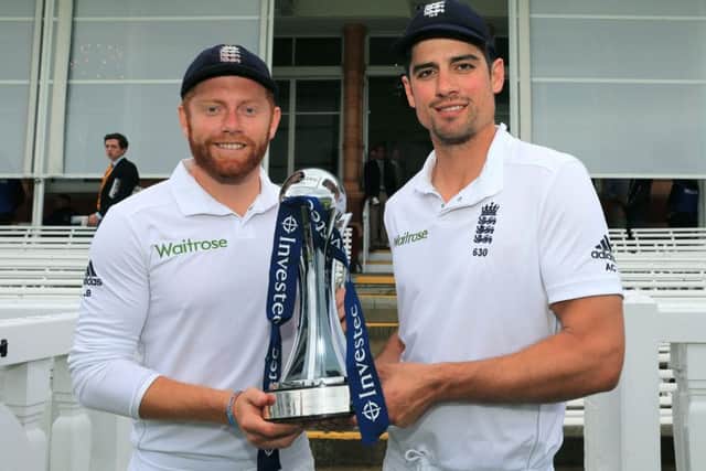 England Man of the Series Johnny Bairstow (left) and captain Alastair Cook pose with the Investec series trophy.