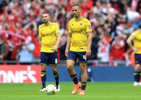 Oxford United's Kemar Roofe (centre).