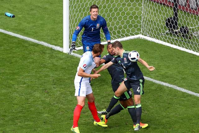 England appeal for a hand ball as Wales' Ben Davies (right) attempts to clear after England's Harry Kane. Picture: Owen Humphreys/PA