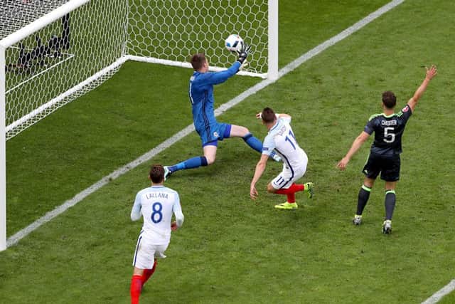 England's Jamie Vardy scoring his sides first goal. Picture: PA.