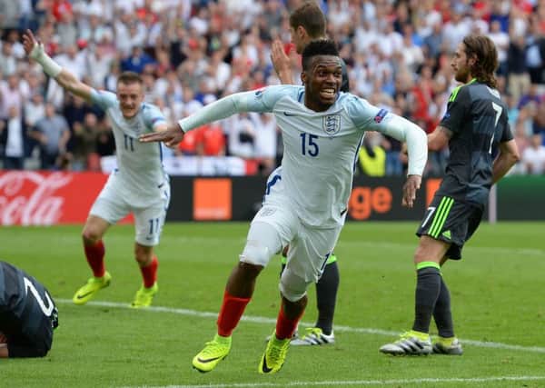 Daniel Sturridge celebrates scoring England's winning goal against Wales yesterday.