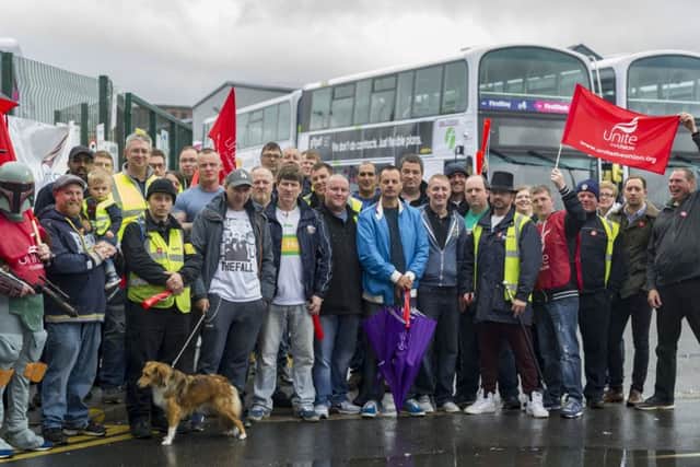 DEFIANT: Workers on the picket line last week.