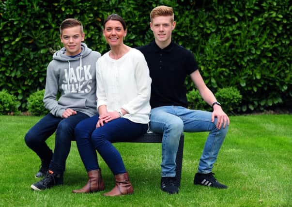 Kate Dawson with her teenage sons Sam and Josh.
