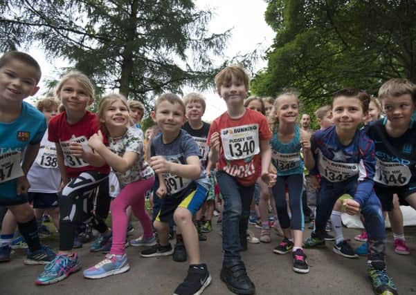 LINE UP: Mini fundraisers tackle the fun runs at the Pudsey 10k race. PIC: Mark Bickerdike