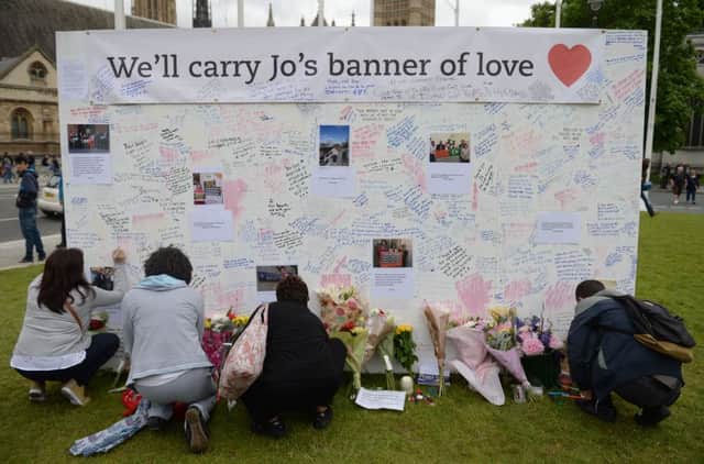 Flowers and tributes in Parliament Square, London, after Labour MP Jo Cox was shot and stabbed to death in the street outside her constituency advice surgery in Birstall