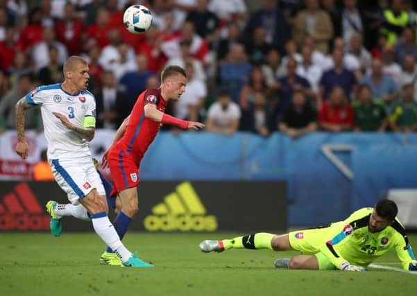 England's Jamie Vardy (centre) has a shot saved by Slovakia goalkeeper Matus Kozacik. PIC: PA