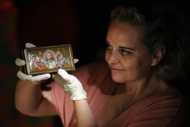 Jenni Shepherd pictured with a King George Chocolate Tin, that were distrbuted to troops in the First World War.
Picture by Simon Hulme